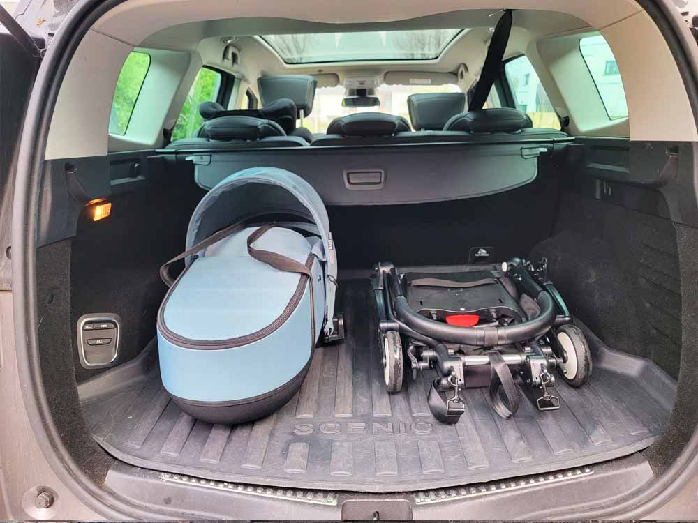 Babyzen YOYO bassinet and YOYO stroller chassis folded in the trunk of a car