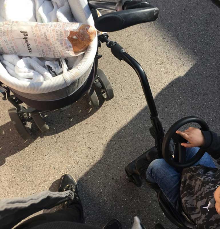 sidecar stroller installed on the side of the car